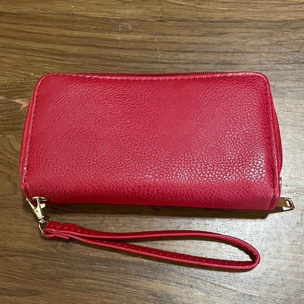 Red wristlet with two wide compartments, zippers, strap